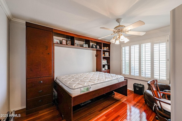 bedroom with ceiling fan, crown molding, and hardwood / wood-style flooring