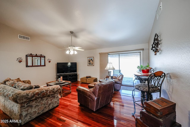 living room with hardwood / wood-style flooring, ceiling fan, and lofted ceiling