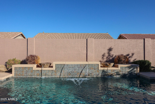 view of swimming pool featuring pool water feature