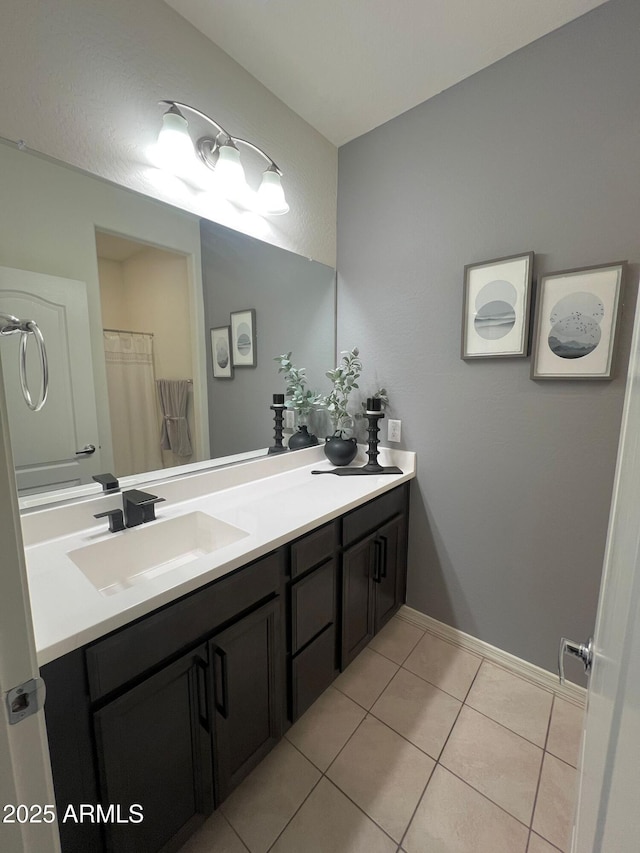 bathroom featuring tile patterned floors and vanity