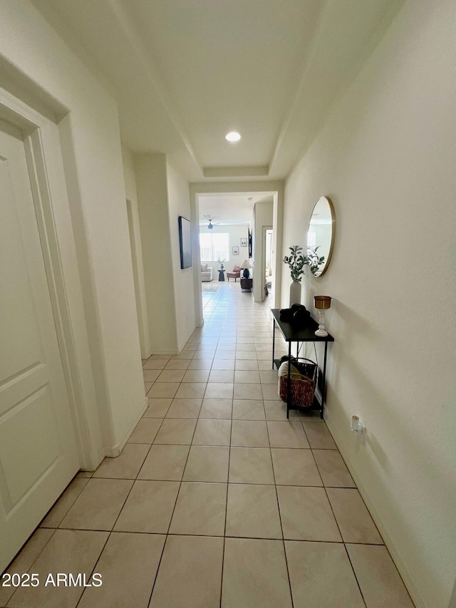 corridor featuring light tile patterned floors