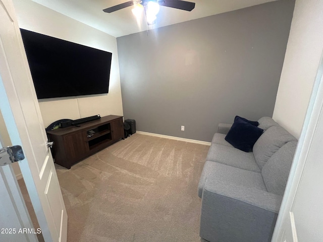 living room featuring ceiling fan and light carpet