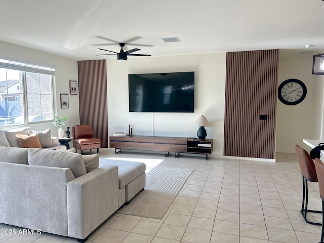 living room with light tile patterned floors and ceiling fan