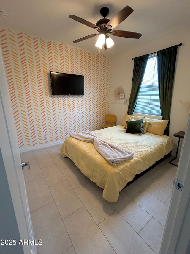 tiled bedroom with ceiling fan