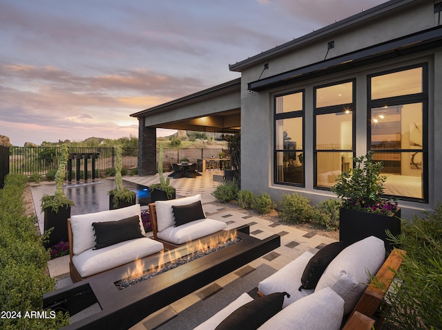 patio terrace at dusk with an outdoor hangout area