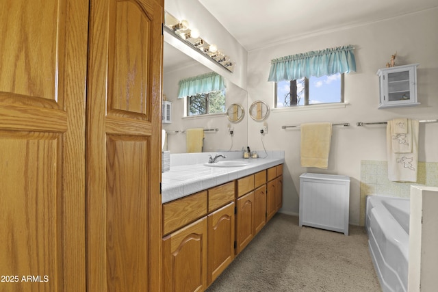 bathroom featuring carpet flooring, vanity, and a bath