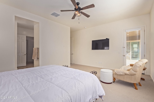 bedroom with ceiling fan and light colored carpet