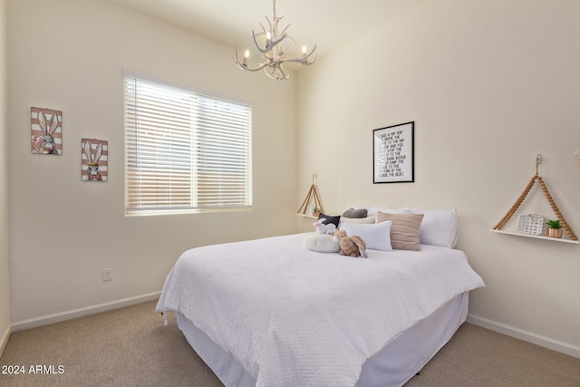 bedroom with carpet floors and a chandelier