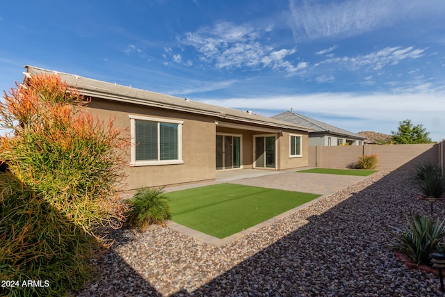 rear view of property featuring a patio