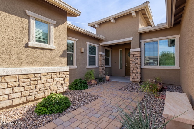 doorway to property featuring a patio area