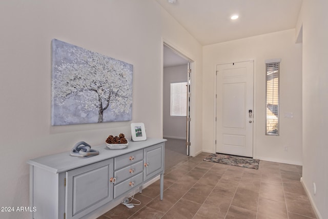 foyer entrance featuring light tile patterned floors