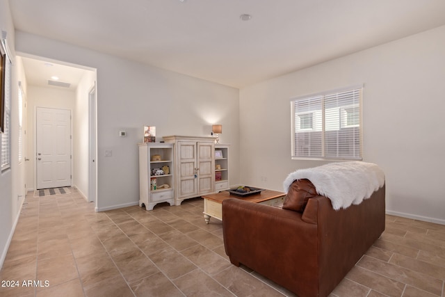 living room with tile patterned floors