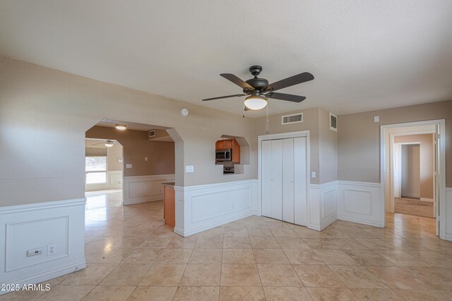 406 E Saguaro St, Casa Grande, AZ 85122 - empty room featuring light tile patterned flooring and ceiling fan