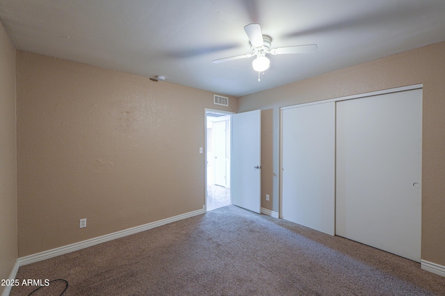 406 E Saguaro St, Casa Grande, AZ 85122 - unfurnished bedroom with ceiling fan, a closet, and carpet