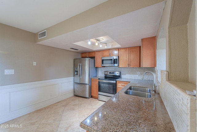406 E Saguaro St, Casa Grande, AZ 85122 - kitchen with stone counters, appliances with stainless steel finishes, sink, decorative backsplash, and light tile patterned floors