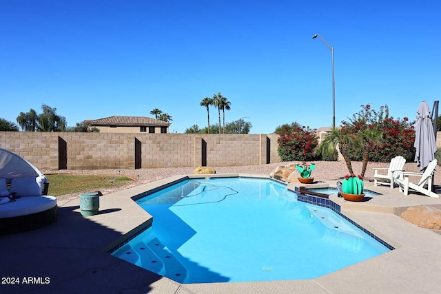 view of swimming pool with a patio area