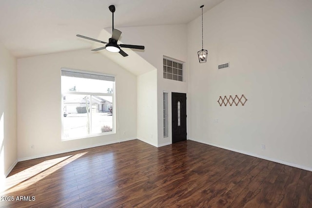 unfurnished living room with lofted ceiling, ceiling fan, and dark hardwood / wood-style flooring