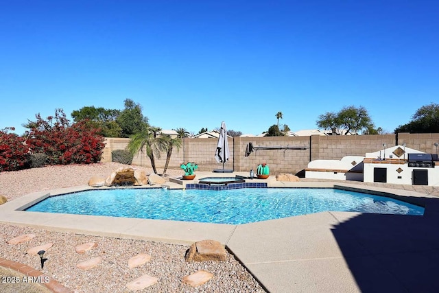 view of pool with an in ground hot tub