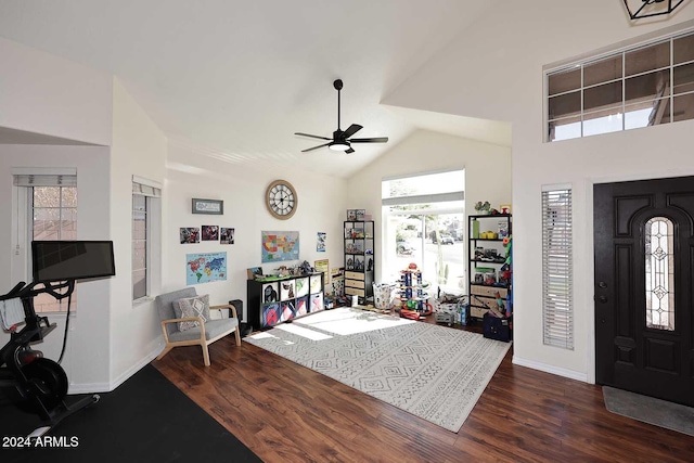 foyer entrance featuring ceiling fan, dark wood-type flooring, and lofted ceiling