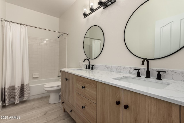 full bathroom with hardwood / wood-style floors, toilet, vanity, and shower / bathtub combination with curtain