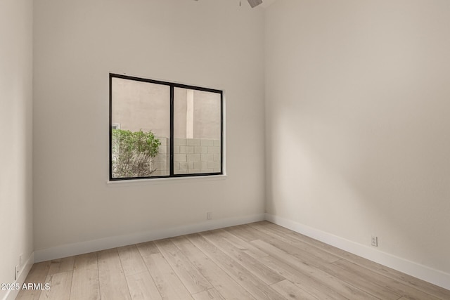 empty room featuring ceiling fan and light wood-type flooring