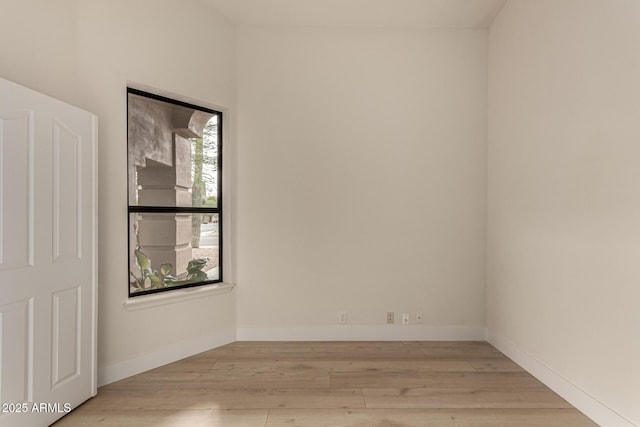 spare room with light wood-type flooring