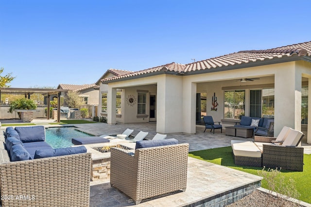 exterior space with an outdoor kitchen, an outdoor living space, a patio, and stucco siding