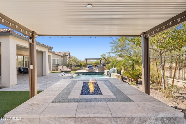 view of patio featuring a fire pit and a fenced backyard