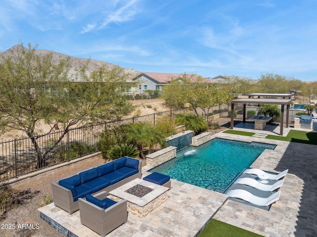 view of swimming pool featuring an outdoor living space with a fire pit, a patio, a fenced backyard, and a fenced in pool