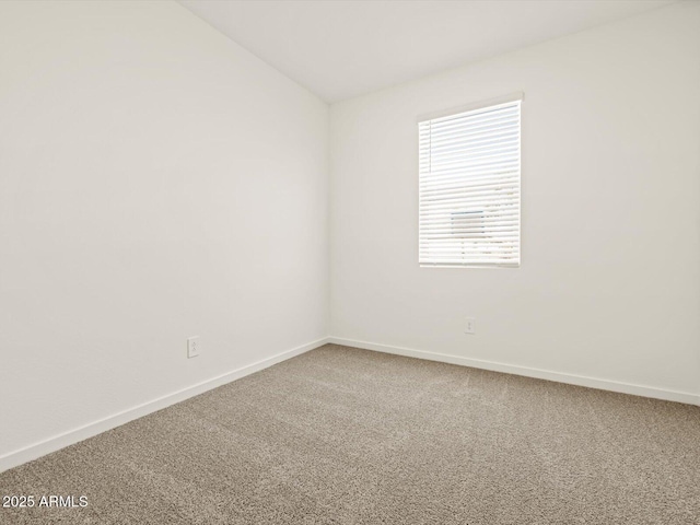 16015 W Desert Hollow Dr, Surprise, AZ 85387 - carpeted spare room with baseboards and lofted ceiling