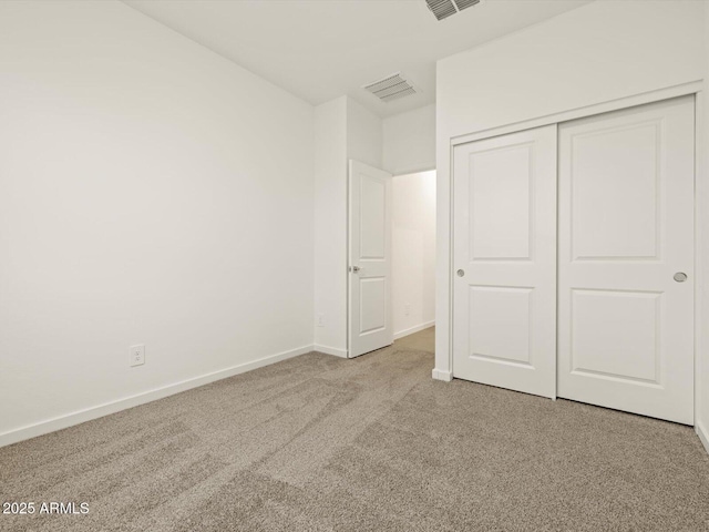 16015 W Desert Hollow Dr, Surprise, AZ 85387 - unfurnished bedroom featuring carpet flooring, baseboards, and a closet