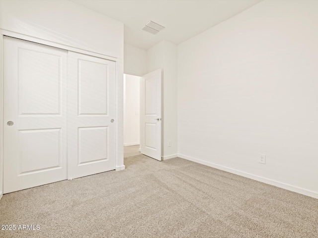 16015 W Desert Hollow Dr, Surprise, AZ 85387 - unfurnished bedroom featuring carpet floors, a closet, and baseboards
