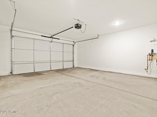 16015 W Desert Hollow Dr, Surprise, AZ 85387 - garage with a garage door opener and baseboards