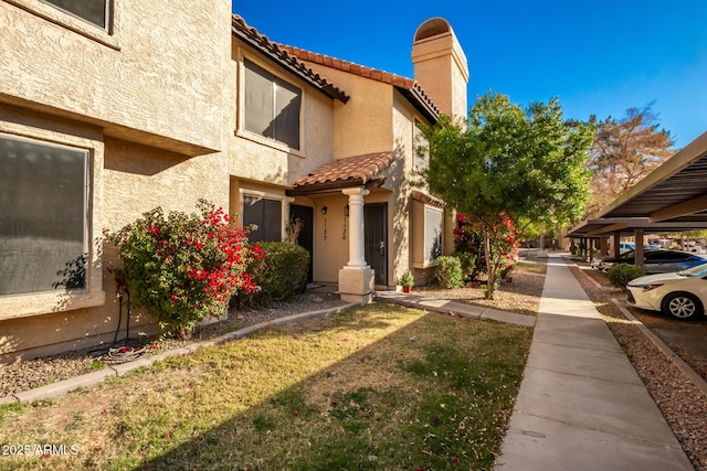 view of property exterior with a carport