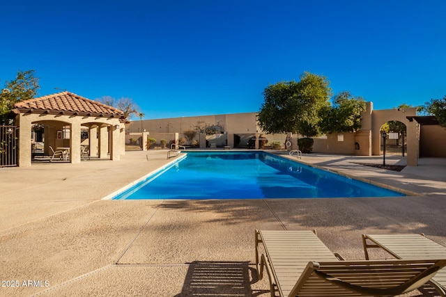 view of swimming pool with a patio