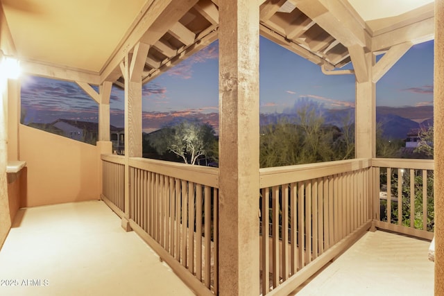 view of balcony at dusk