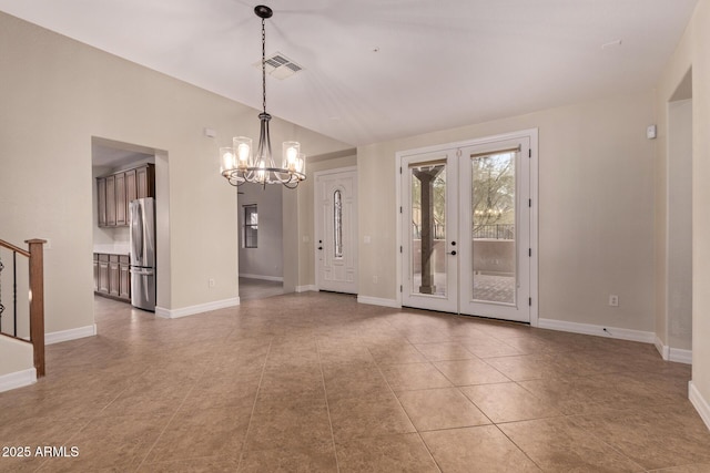 interior space featuring visible vents, a notable chandelier, stairway, and baseboards