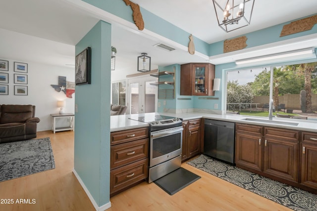 1406 E Jasper Dr, Chandler, AZ 85225 - kitchen featuring dishwashing machine, stainless steel electric range, light wood-style floors, light countertops, and a sink