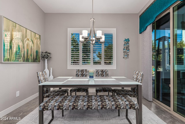 dining space featuring an inviting chandelier