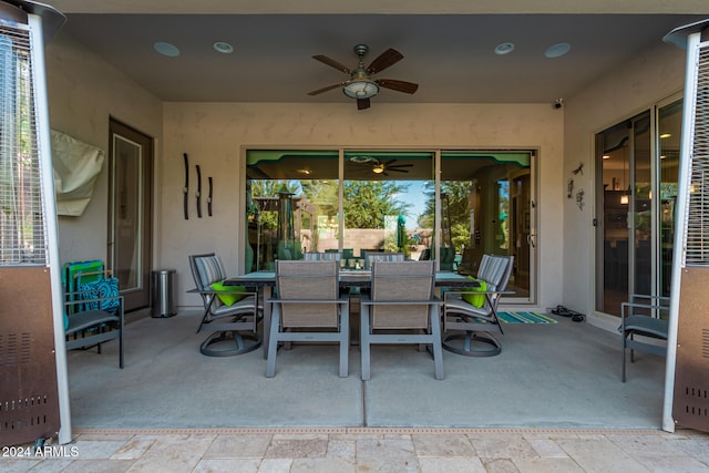 view of patio featuring ceiling fan