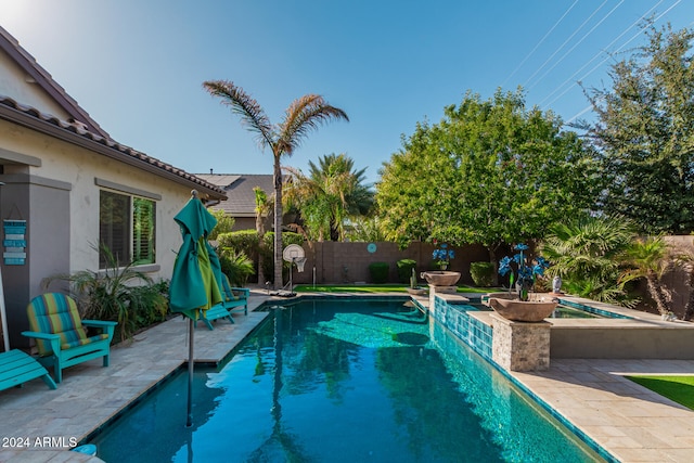 view of swimming pool featuring a patio area