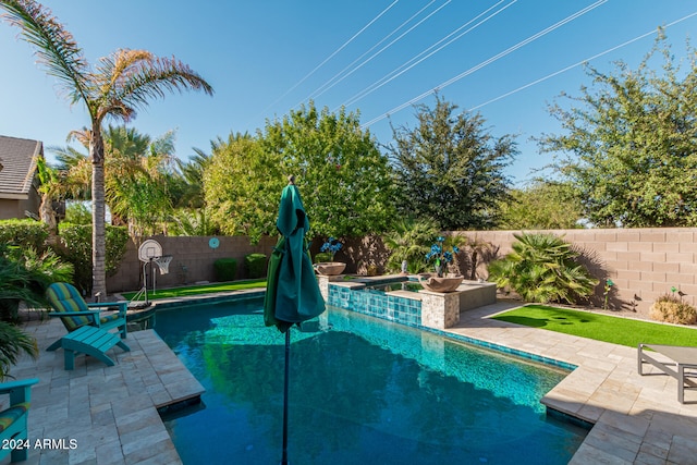 view of pool featuring an in ground hot tub and a patio