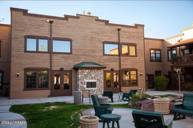 rear view of property featuring a patio