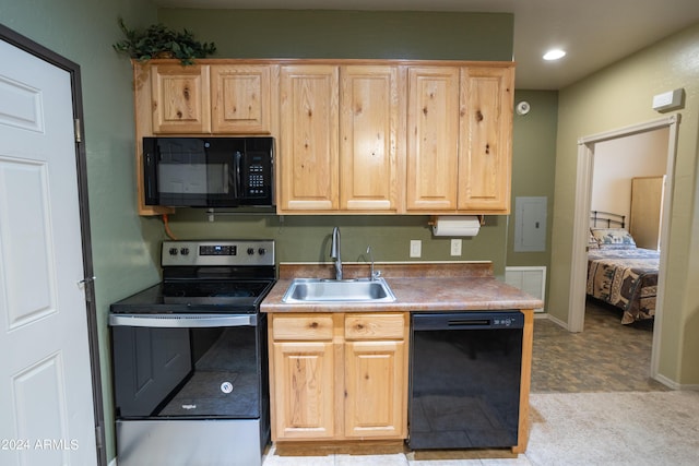 kitchen featuring sink, light brown cabinets, and black appliances