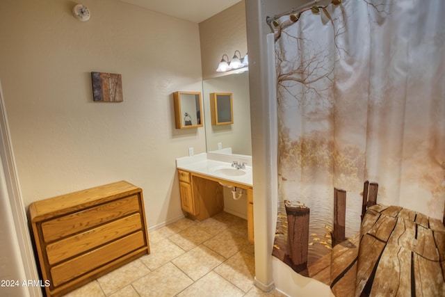 bathroom with vanity and tile patterned flooring