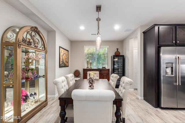 dining space with light wood-type flooring