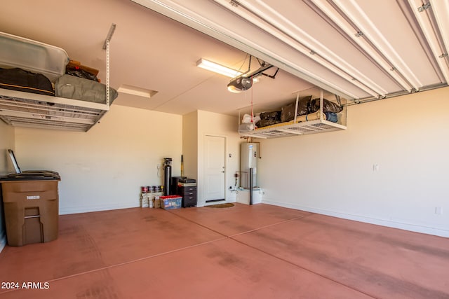 garage featuring a garage door opener and water heater