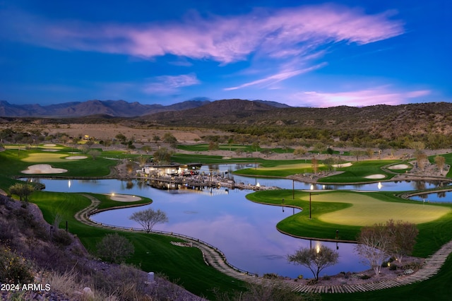 surrounding community featuring a water and mountain view