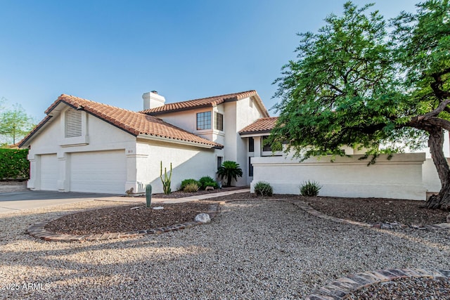 6133 E Saddleback St, Mesa, AZ 85215 - mediterranean / spanish home featuring a garage, a chimney, a tile roof, stucco siding, and driveway