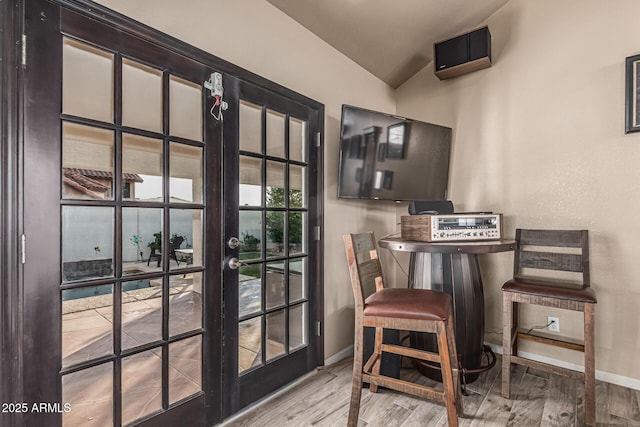 6133 E Saddleback St, Mesa, AZ 85215 - entryway with baseboards, wood finished floors, vaulted ceiling, french doors, and a wall mounted AC